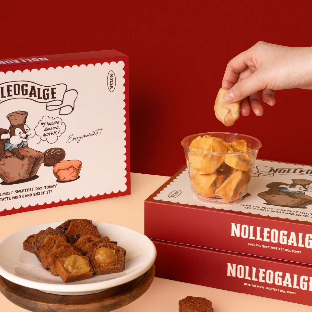 Assorted NOLSK financier rusks and illustrated gift boxes with brand squirrel mascot